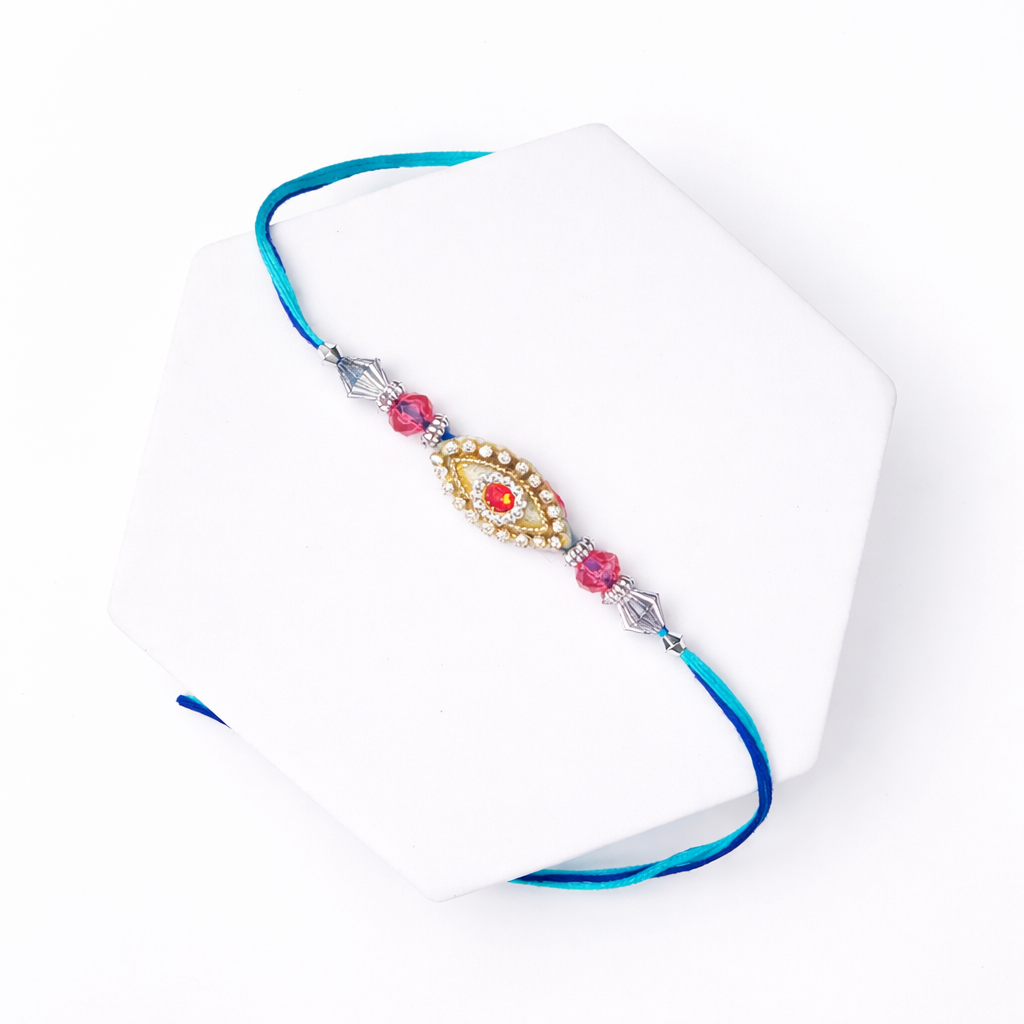 Blue Thread Rakhi with Red Stone Center