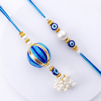 Striped Pom-Pom Evil Eye Bhai-Bhabhi Rakhi Set