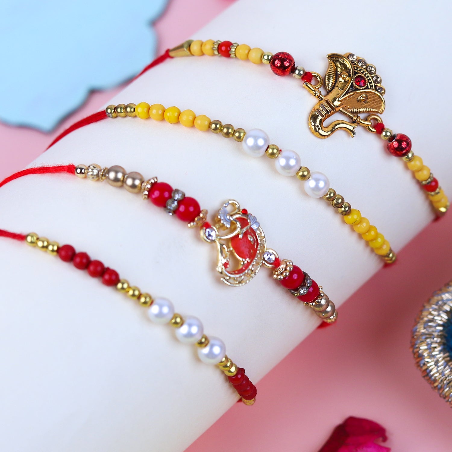 Ganesha Rakhi Set of 4 – Premium Designer Rakhis with Puja Thali & Roli Chawal