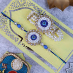 Handcrafted Evil Eye Rakhi & Triple-Strand Pearl Lumba Set with Coordinated Mini Puja Thali