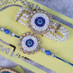 Handcrafted Evil Eye Rakhi & Triple-Strand Pearl Lumba Set with Coordinated Mini Puja Thali
