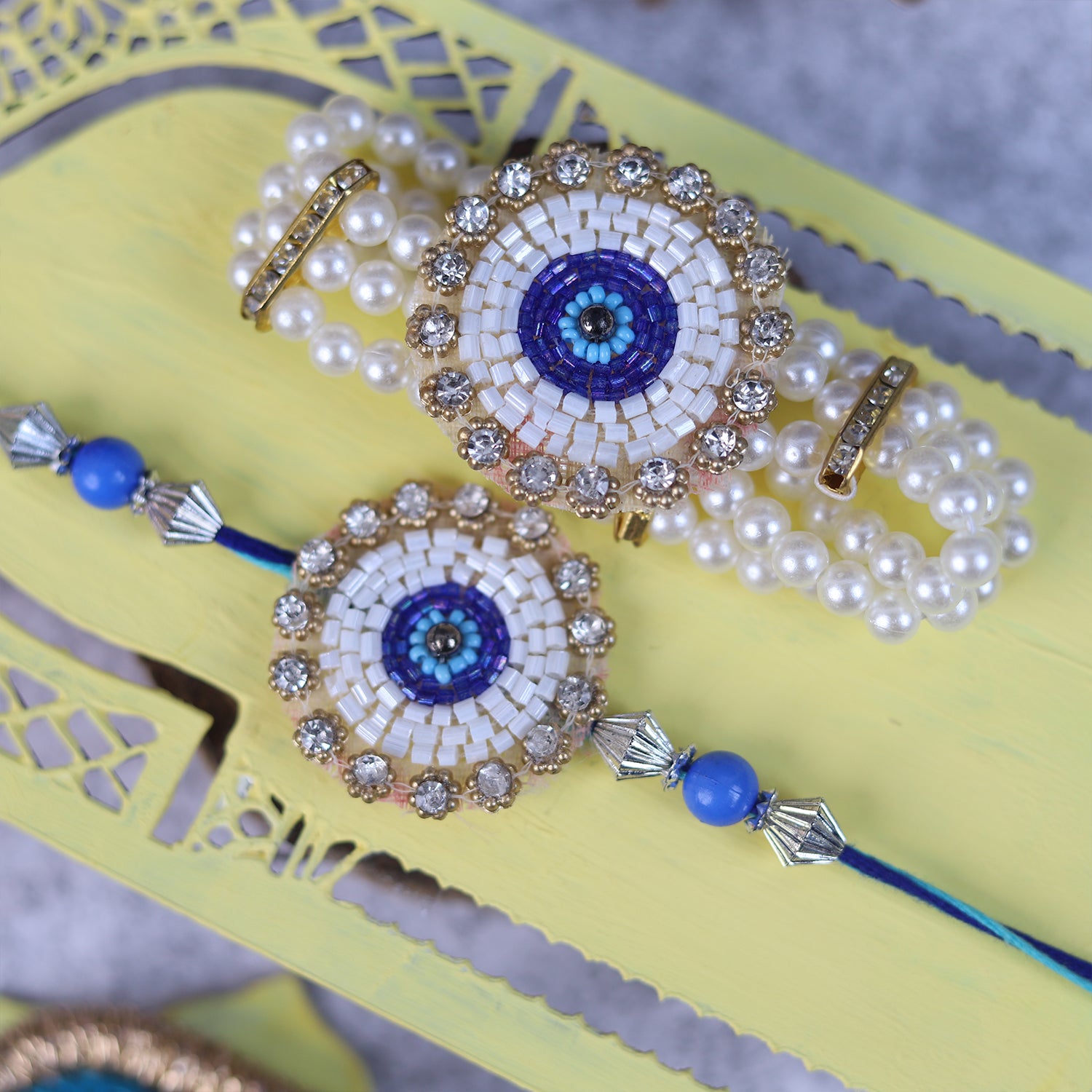Handcrafted Evil Eye Rakhi & Triple-Strand Pearl Lumba Set with Coordinated Mini Puja Thali