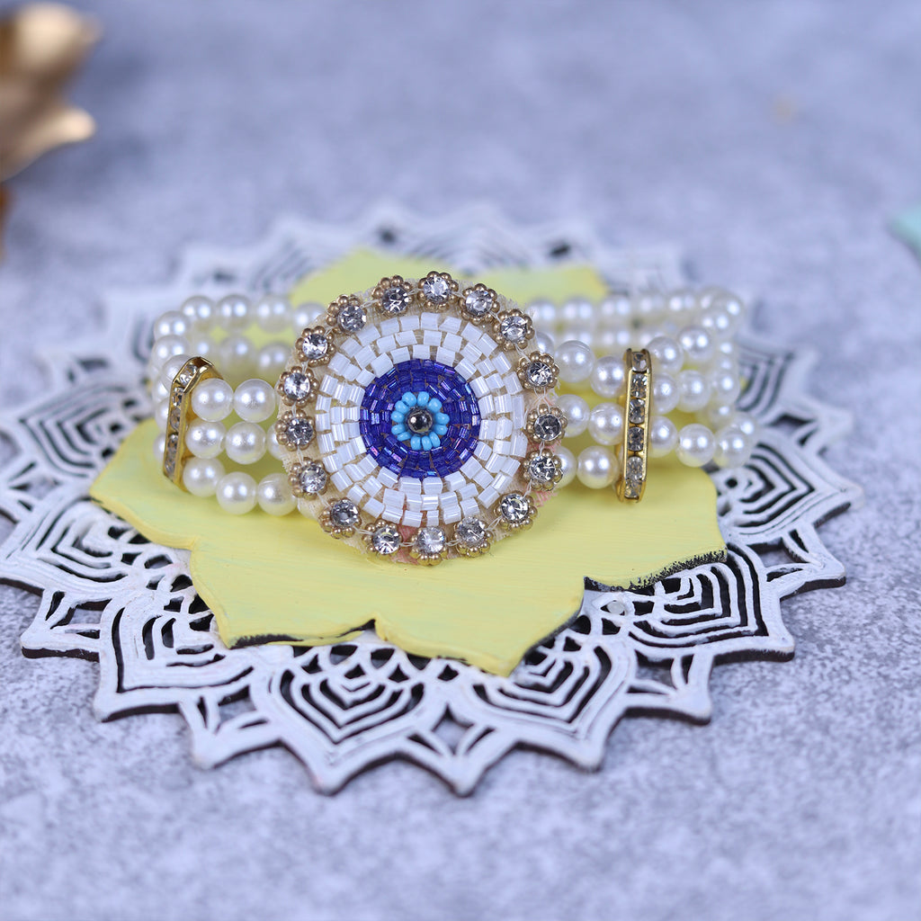 Handcrafted Evil Eye Rakhi & Triple-Strand Pearl Lumba Set with Coordinated Mini Puja Thali