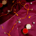 Sacred Silver Om Charm Rakhi – Handcrafted Spiritual Mauli Thread for Brother