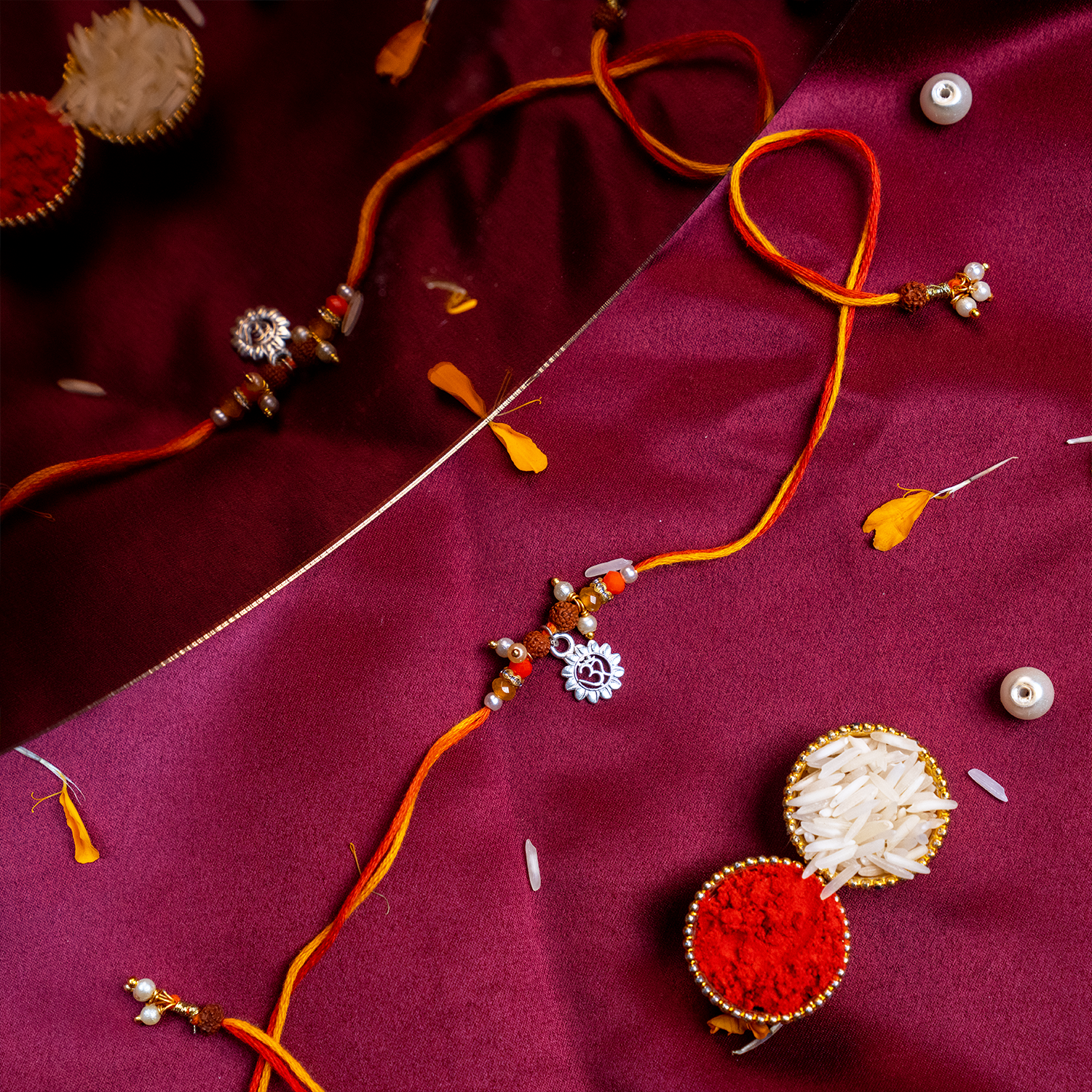 Sacred Silver Om Charm Rakhi – Handcrafted Spiritual Mauli Thread for Brother
