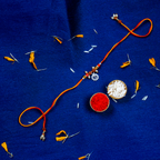 Sacred Silver Om Charm Rakhi – Handcrafted Spiritual Mauli Thread for Brother