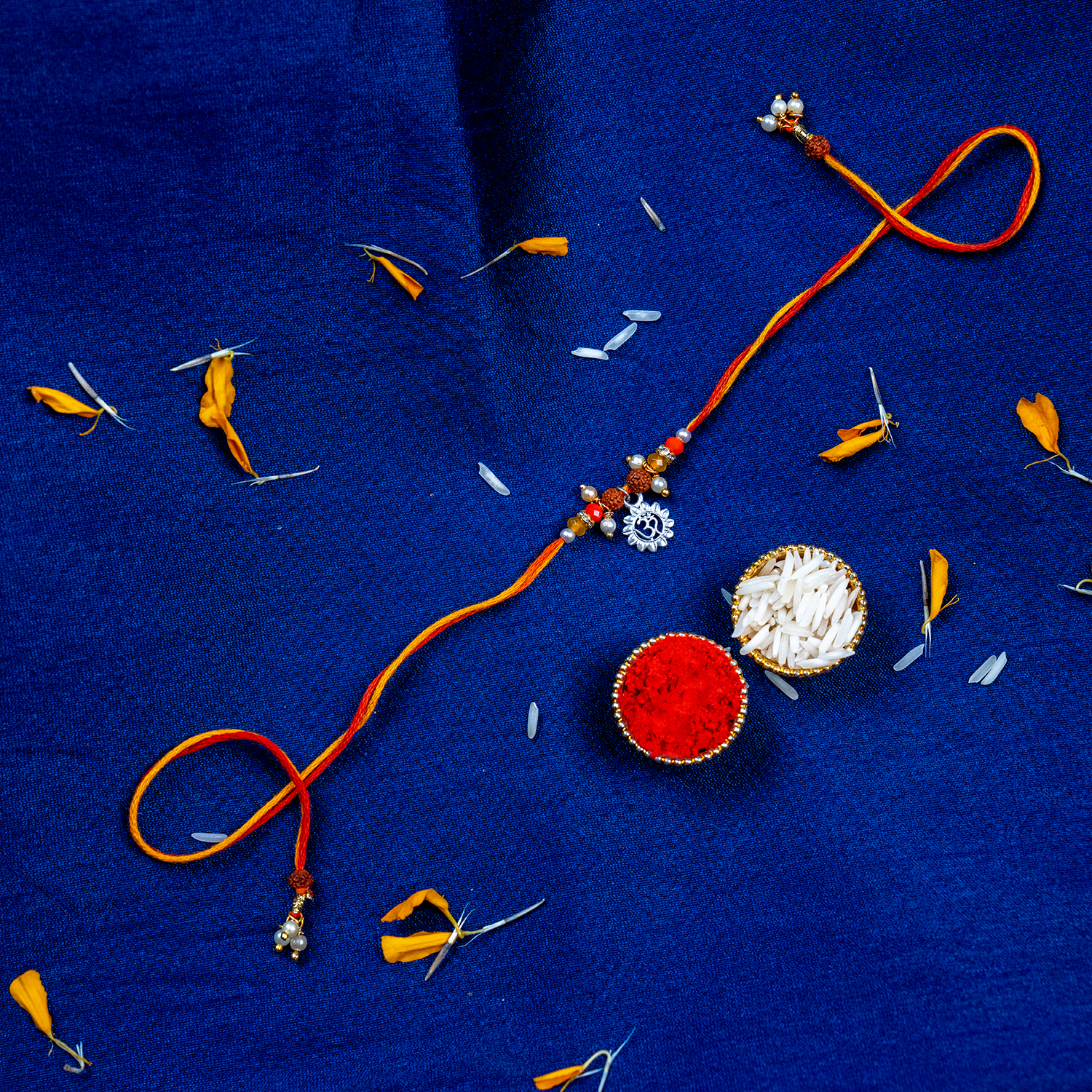 Sacred Silver Om Charm Rakhi – Handcrafted Spiritual Mauli Thread for Brother