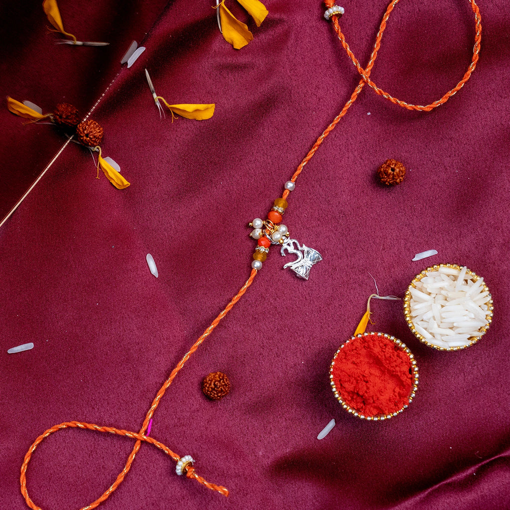 Sacred Silver Shiva Trishul & Damru Rakhi – Handcrafted Mauli Thread for Brother