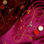 Sacred Silver Ganesha Charm Rakhi – Handcrafted Traditional Mauli Thread for Brother