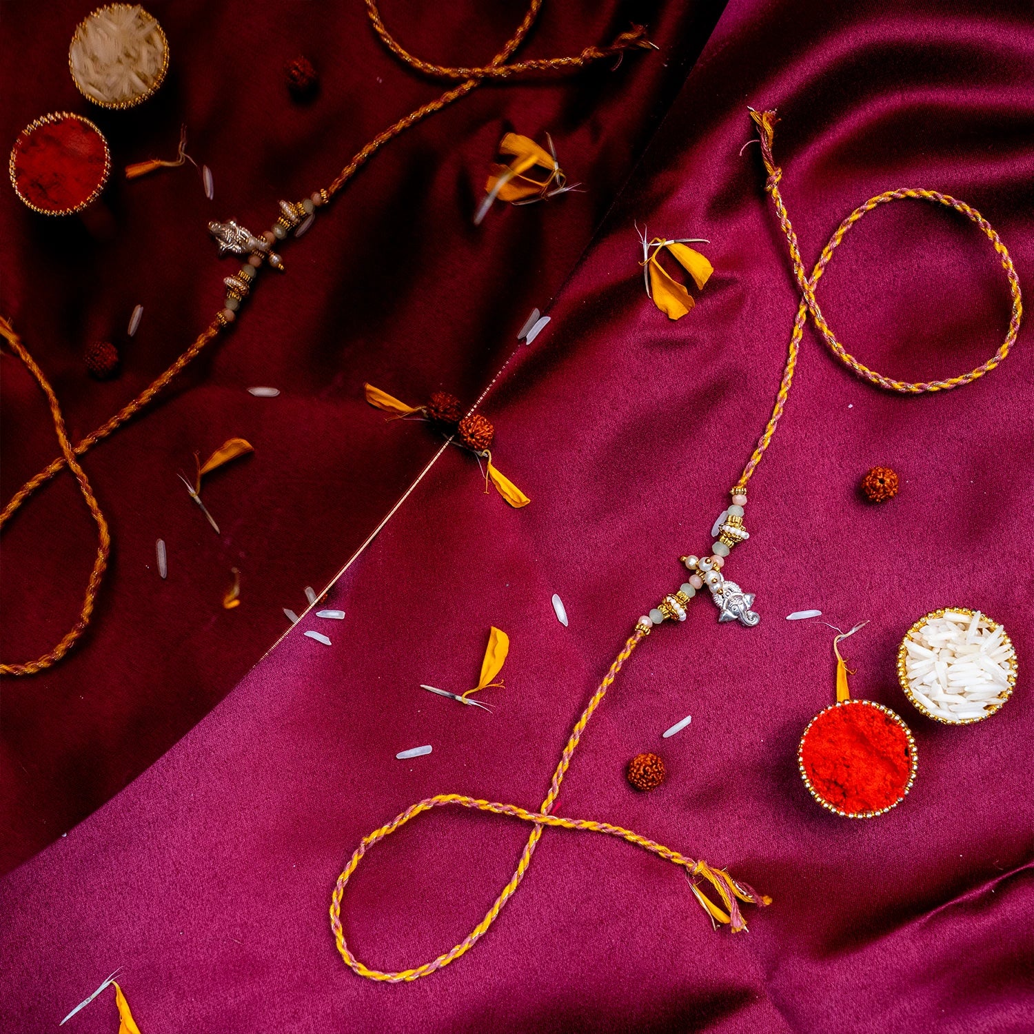 Sacred Silver Ganesha Charm Rakhi – Handcrafted Traditional Mauli Thread for Brother