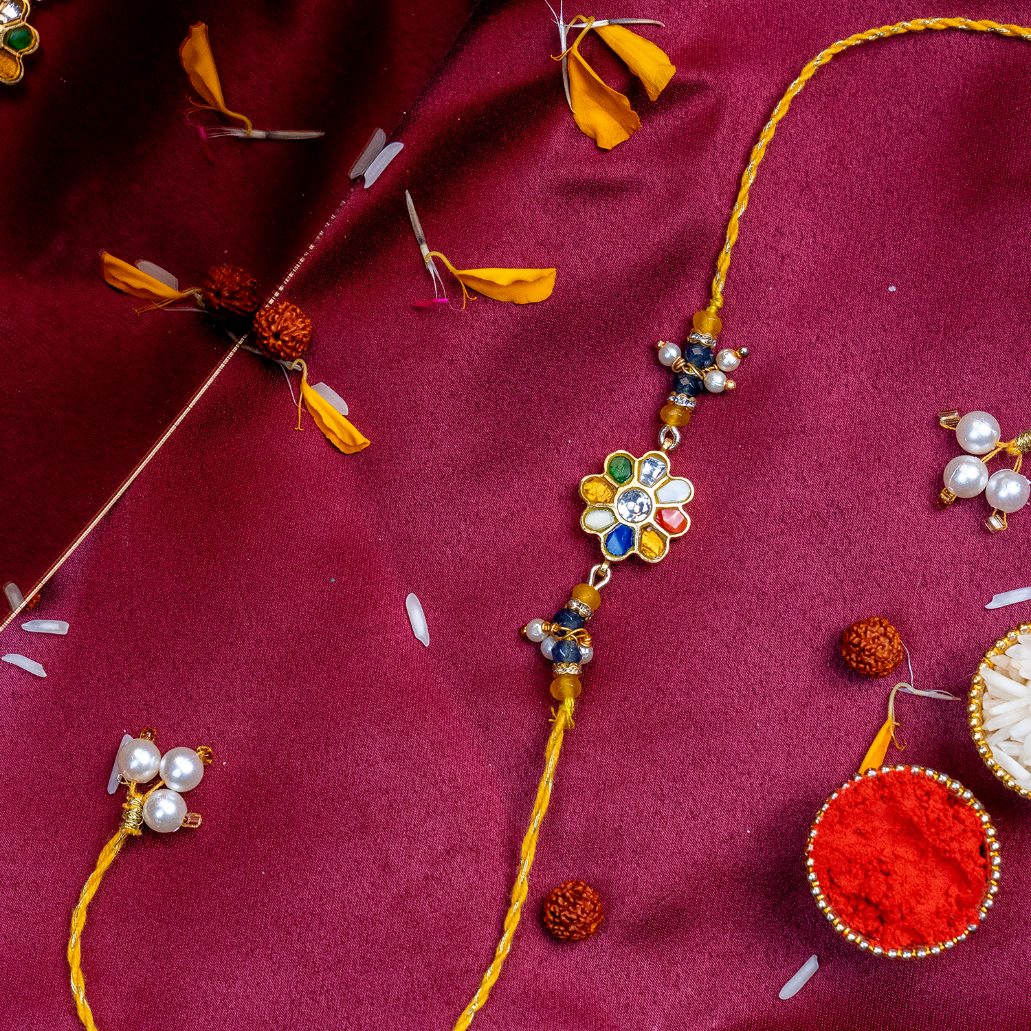Divine Navratna Floral Rakhi – Handcrafted Multi-Color Stone Designer Thread for Brother