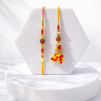 Rudraksha Rakhi with Red Yellow Bead Tassel