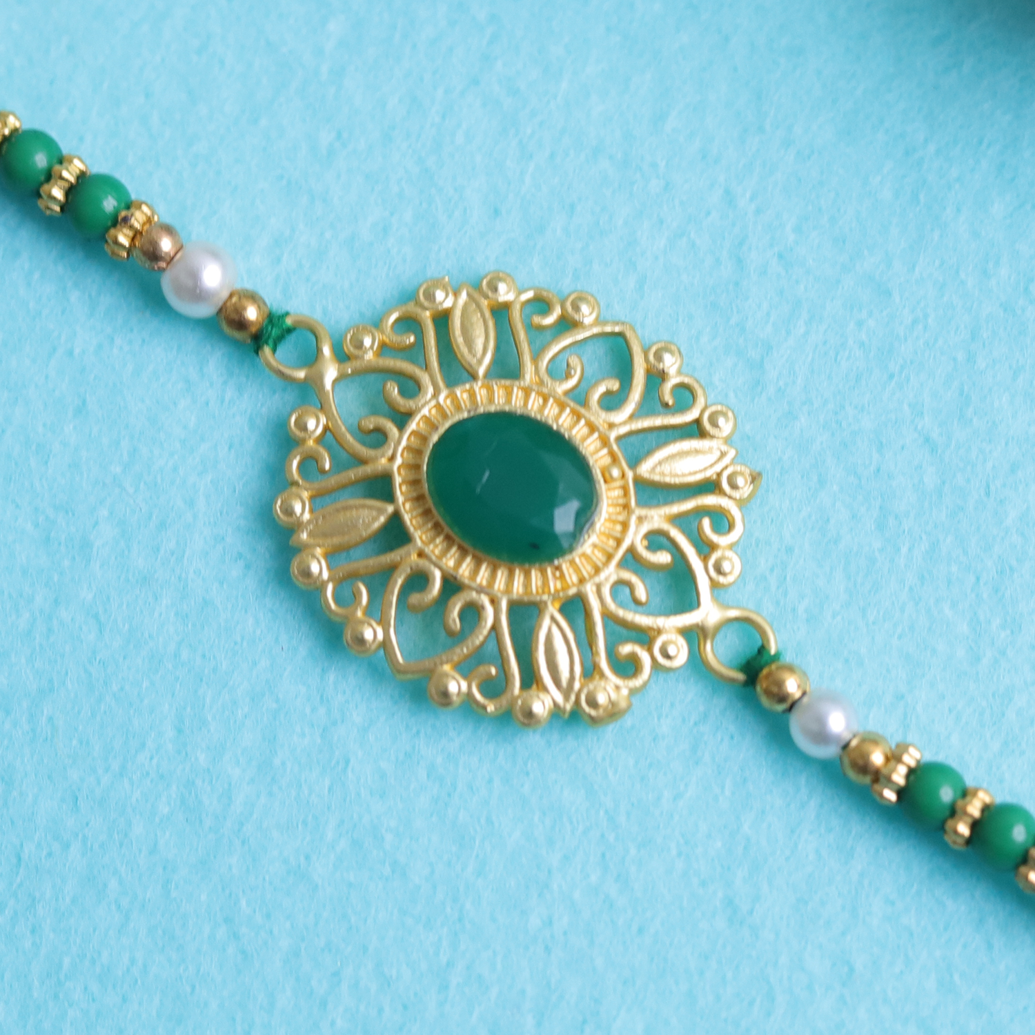 Regal Elegance: Emerald Green & Gold Filigree Designer Single Rakhi