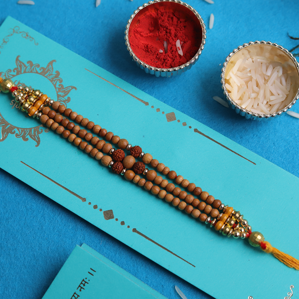 Sacred Bond: Triple-Strand Rudraksha & Sandalwood Designer Rakhi
