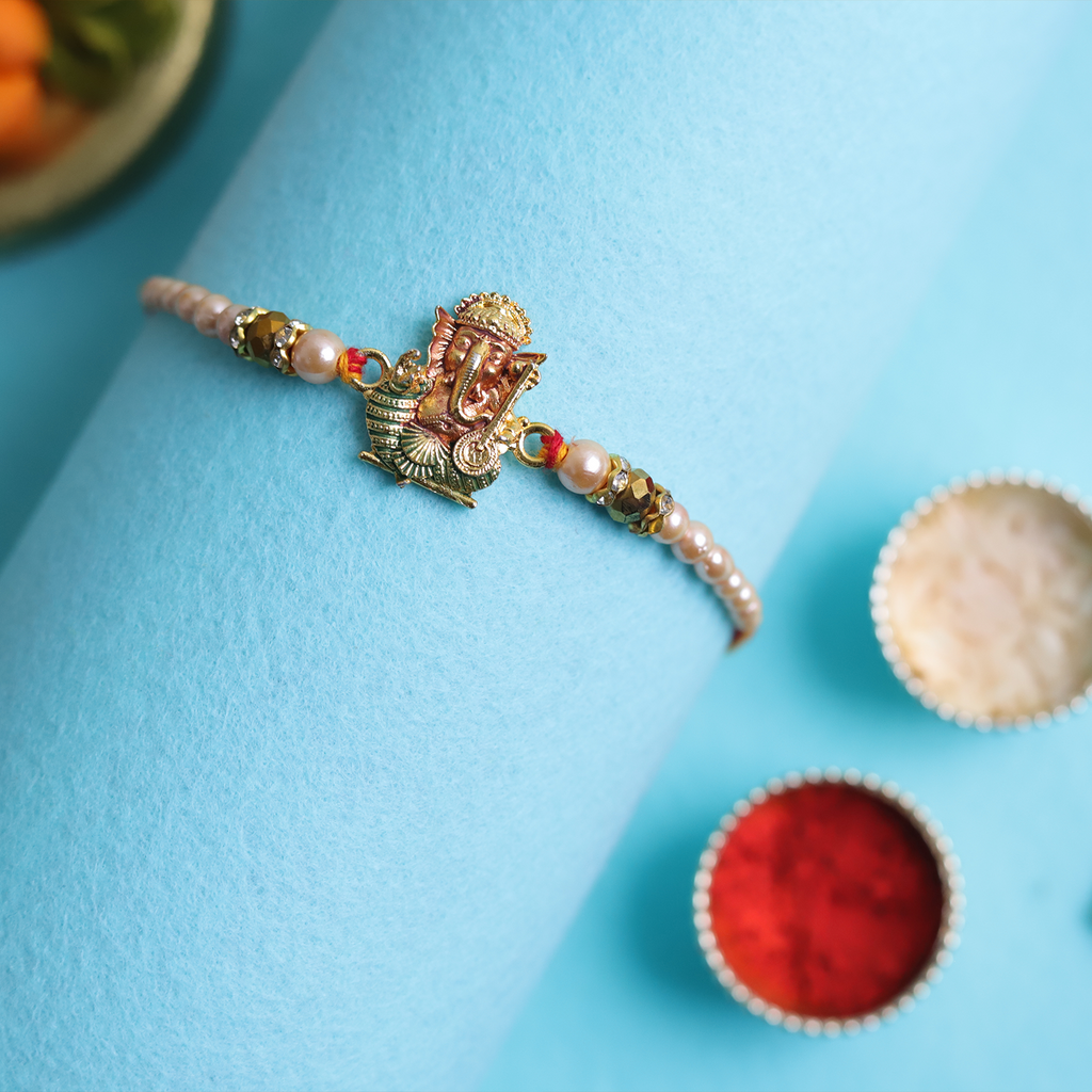 Divine Golden Ganesha Rakhi with Roli-Chawal
