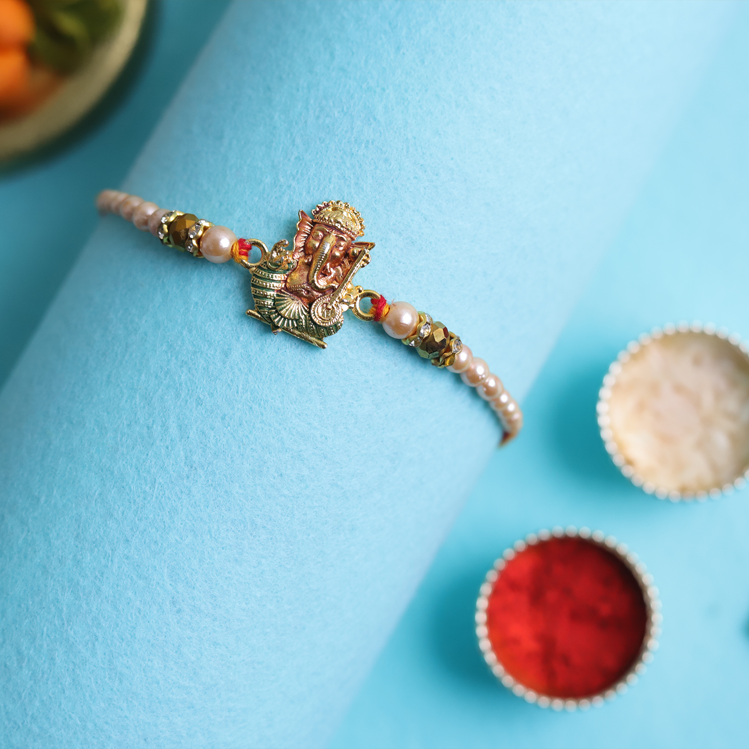 Divine Golden Ganesha Rakhi with Roli-Chawal