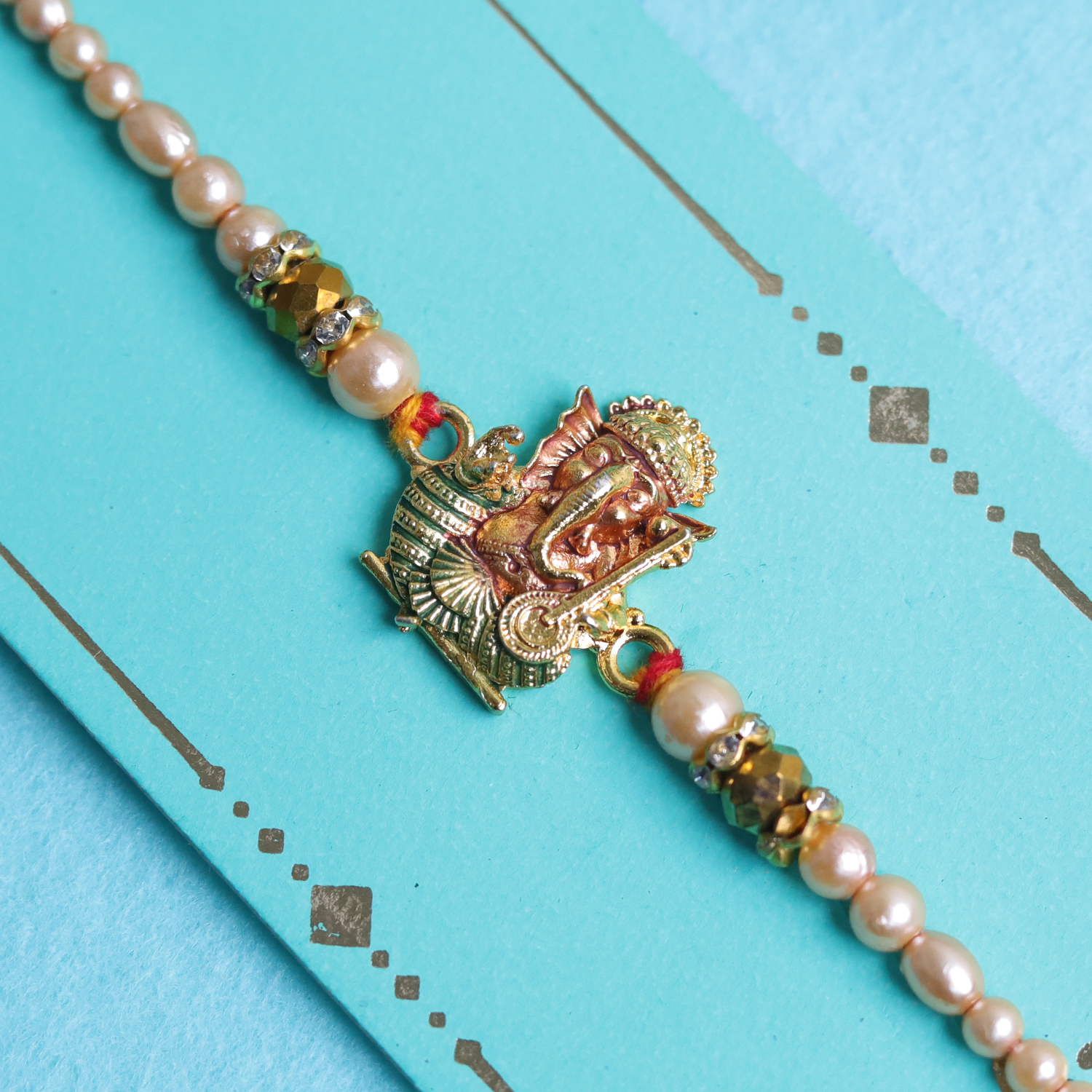 Divine Golden Ganesha Rakhi with Roli-Chawal