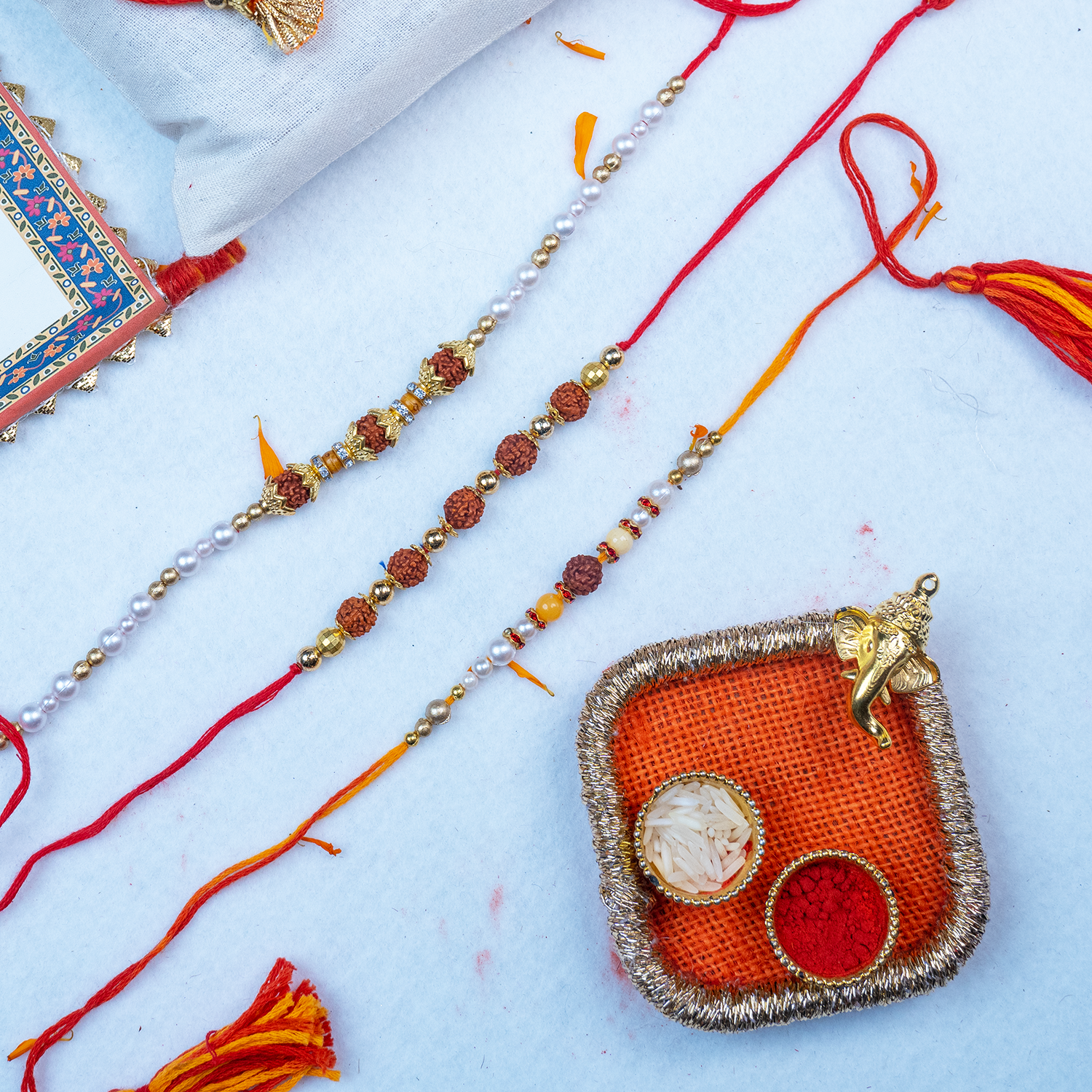 Elegant Rudraksha Rakhi Set with Designer Mini Thali & Message Scroll