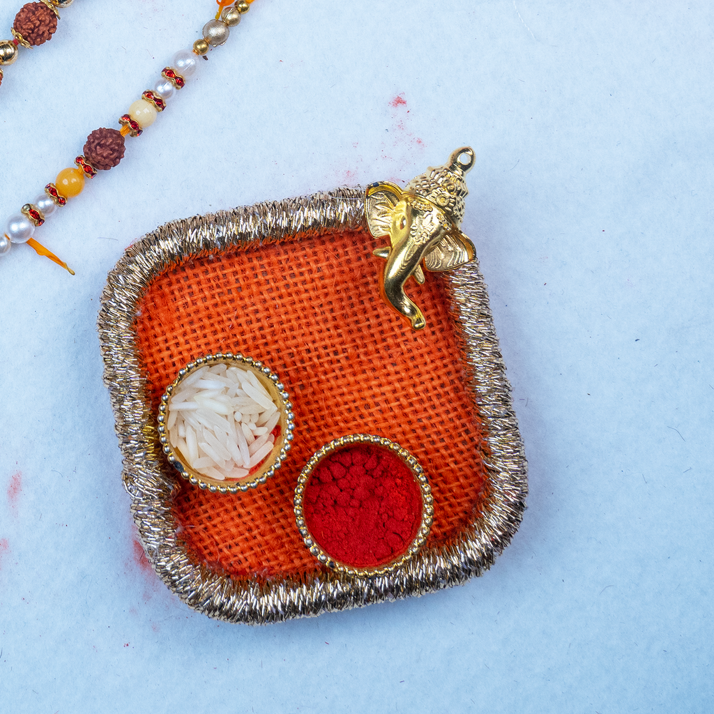 Elegant Rudraksha Rakhi Set with Designer Mini Thali & Message Scroll