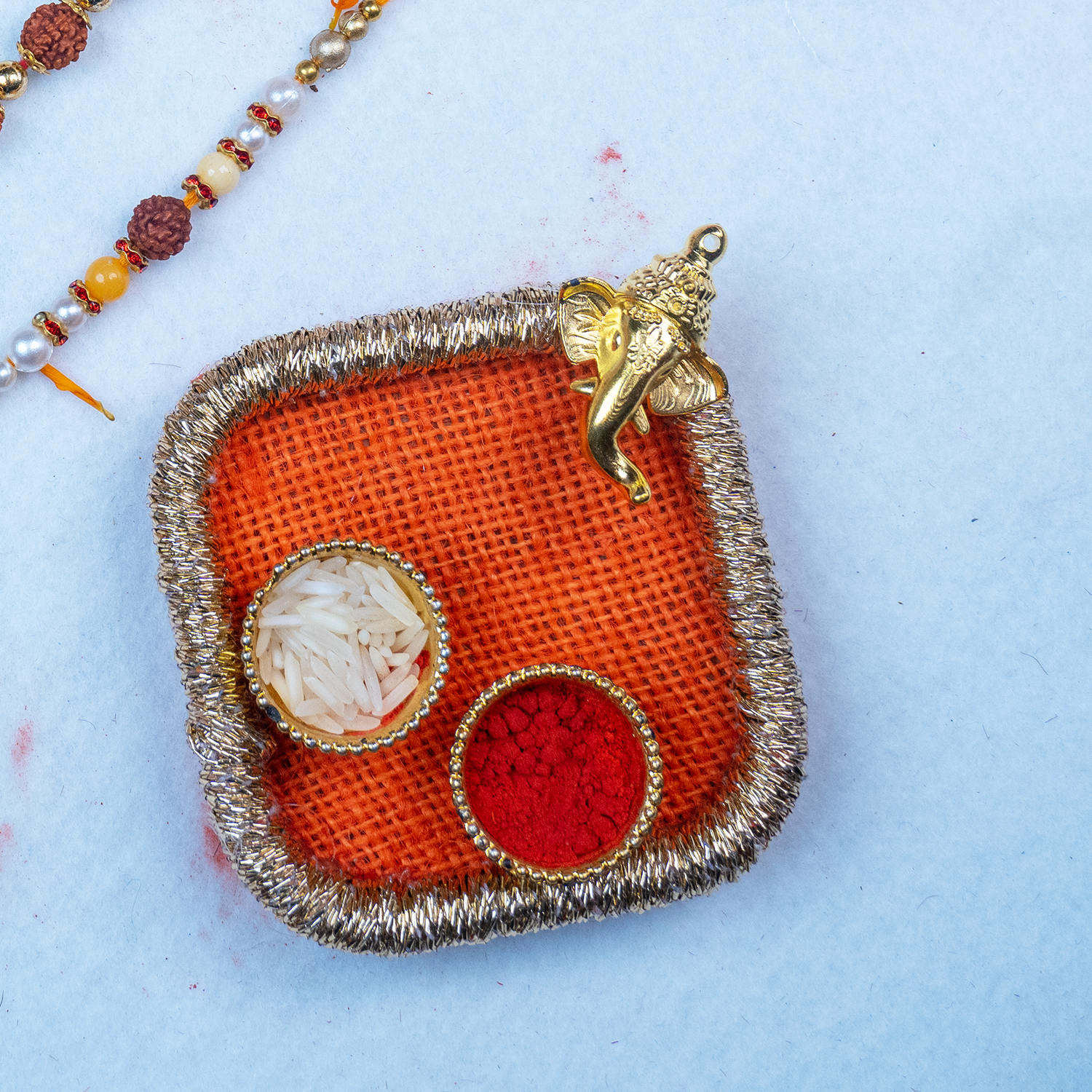 Elegant Rudraksha Rakhi Set with Designer Mini Thali & Message Scroll