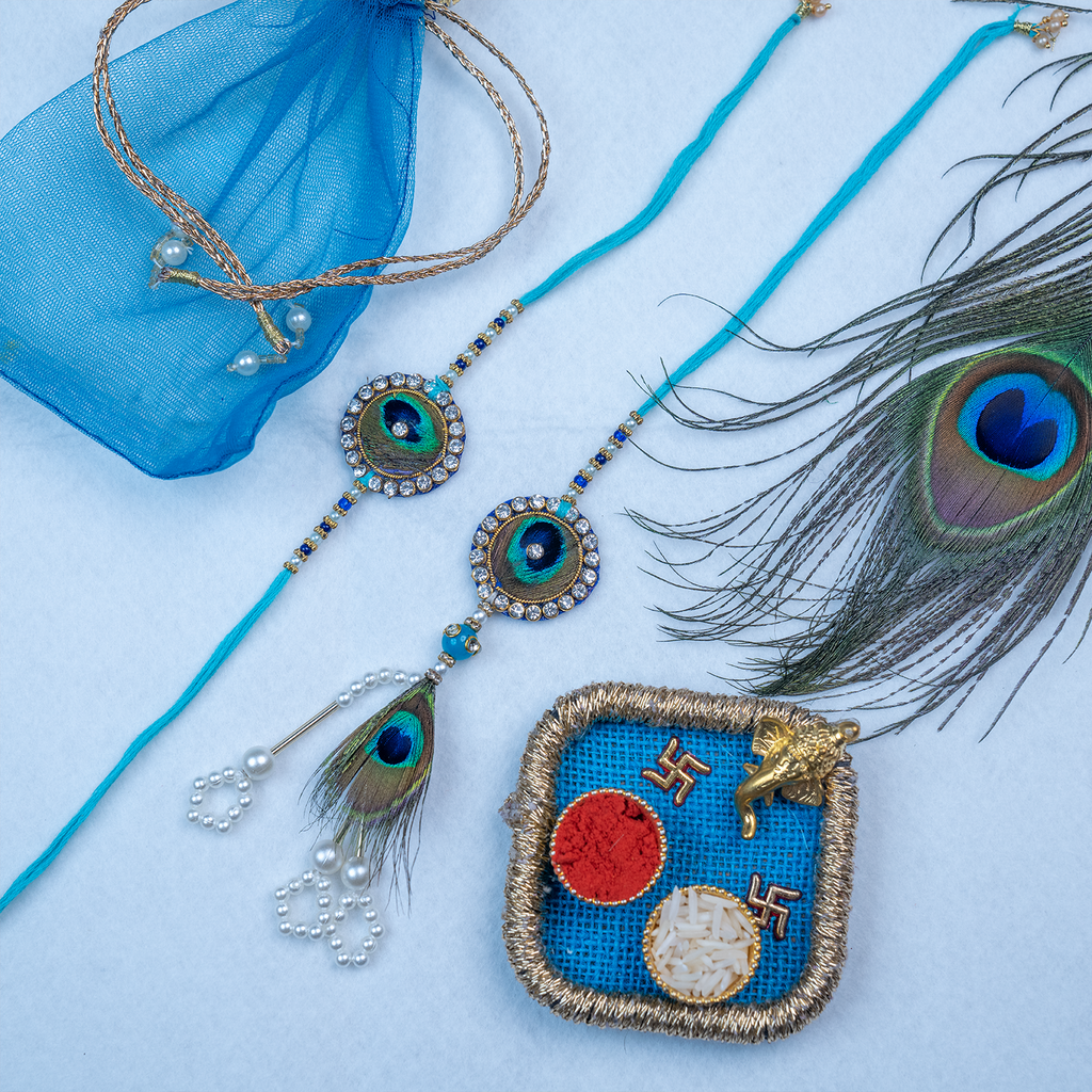 Divine Peacock Bhaiya Bhabhi Rakhi Set – Handcrafted Thali Collection with Blue Net Potli