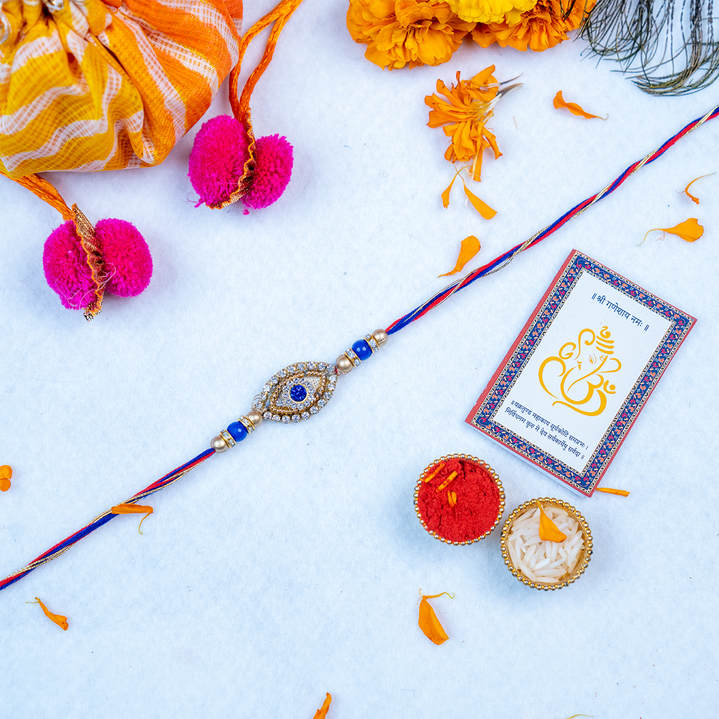 Designer Evil Eye Rakhi Gift Set with Leheriya Potli & Roli-Chawal