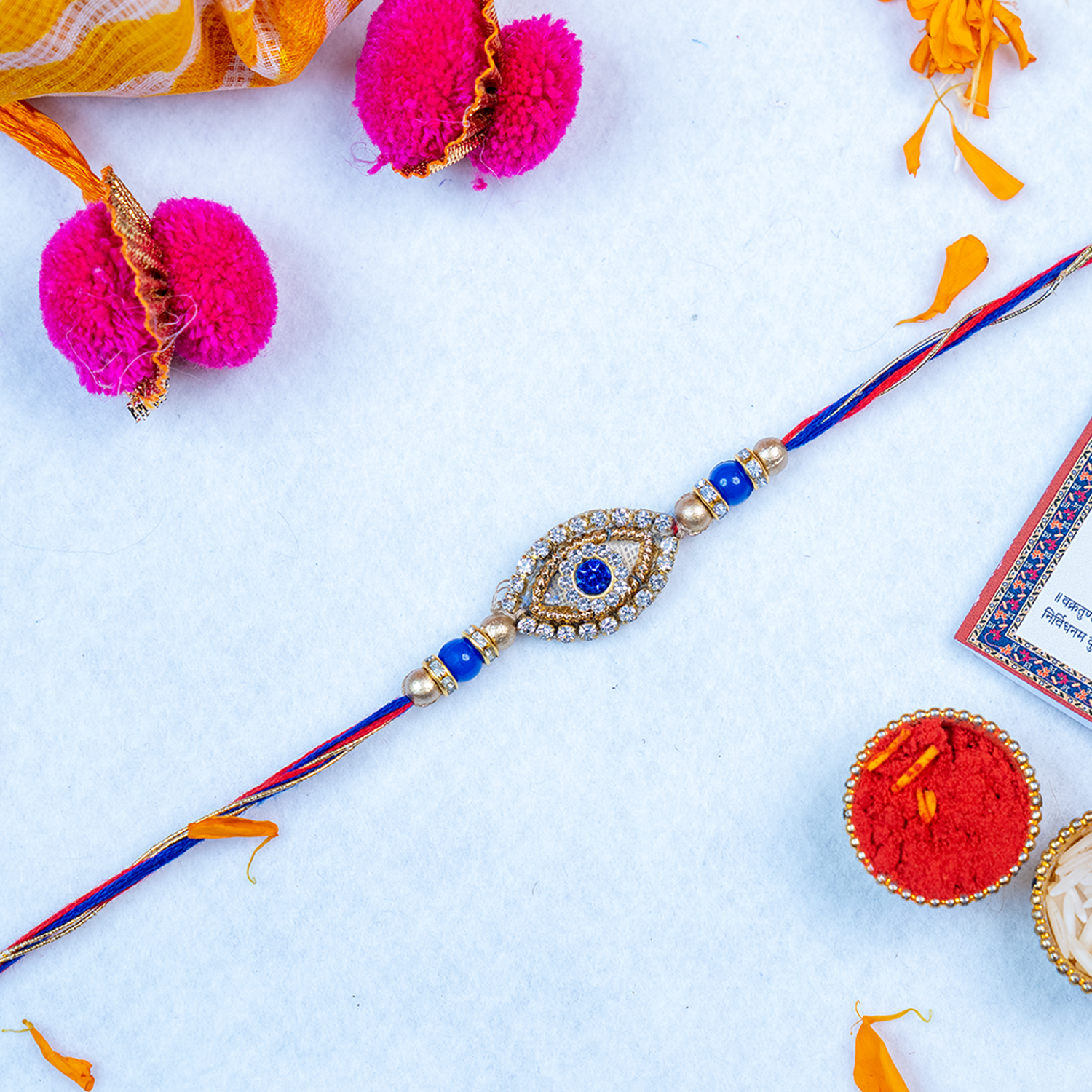 Designer Evil Eye Rakhi Gift Set with Leheriya Potli & Roli-Chawal