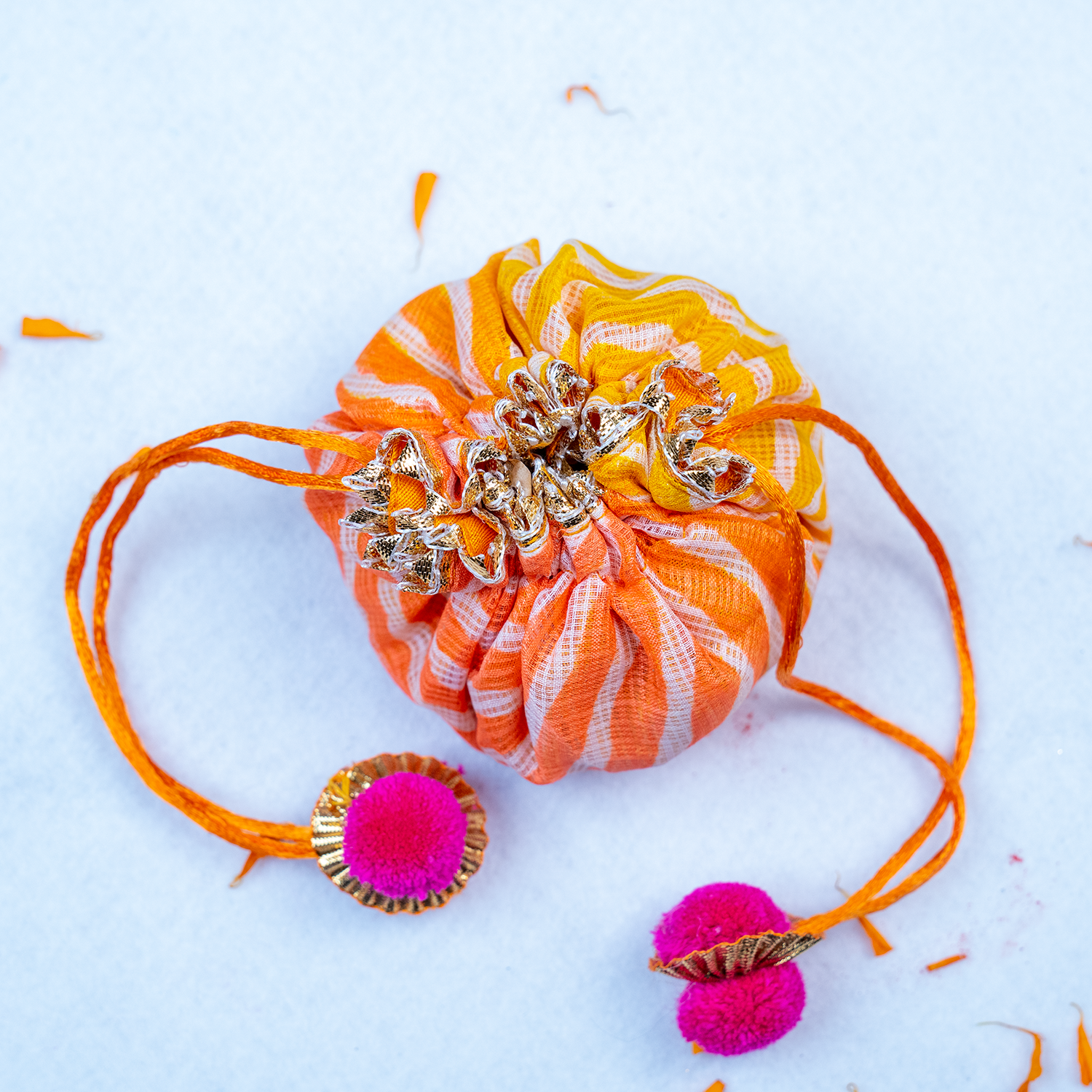 Designer Evil Eye Rakhi Gift Set with Leheriya Potli & Roli-Chawal