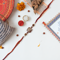 Divine Om & Rudraksha Rakhi Gift Set with Personalized Message Scroll, Roli-Chawal, and Handcrafted Potli