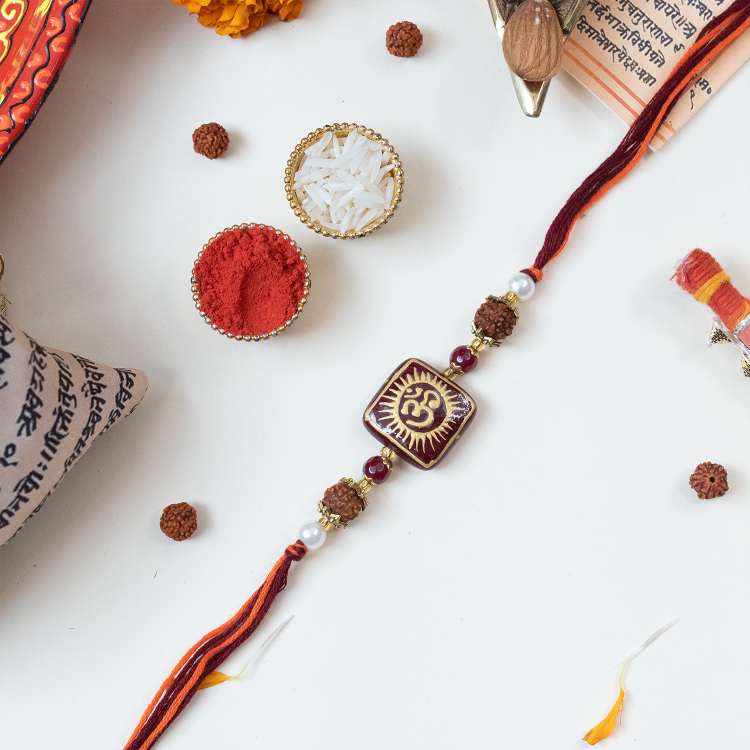 Divine Om & Rudraksha Rakhi Gift Set with Personalized Message Scroll, Roli-Chawal, and Handcrafted Potli