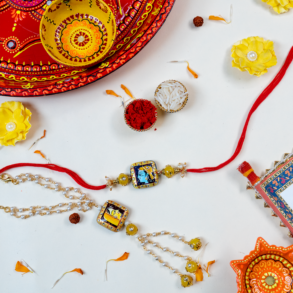 Divine Bhaiya Bhabhi Rakhi Set – Hand-Painted Lord Krishna & Radha Theme with Message Scroll, Roli-Chawal