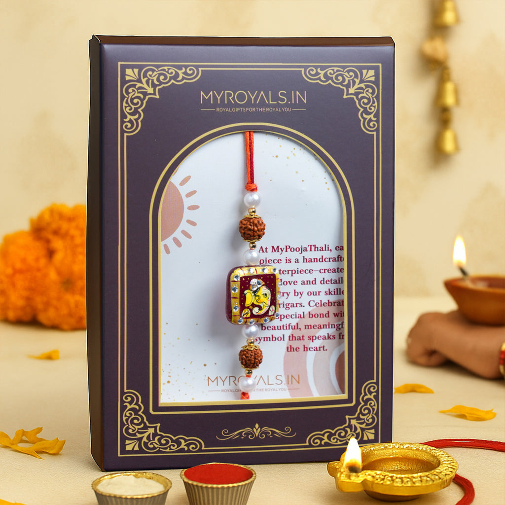 Traditional Divine Ganesha & Pearl Bhaiya Bhabhi Rakhi Combo with Hand-Painted Potli & Scroll Card
