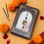 Traditional Divine Ganesha & Pearl Bhaiya Bhabhi Rakhi Combo with Hand-Painted Potli & Scroll Card