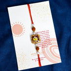 Traditional Divine Ganesha & Pearl Bhaiya Bhabhi Rakhi Combo with Hand-Painted Potli & Scroll Card