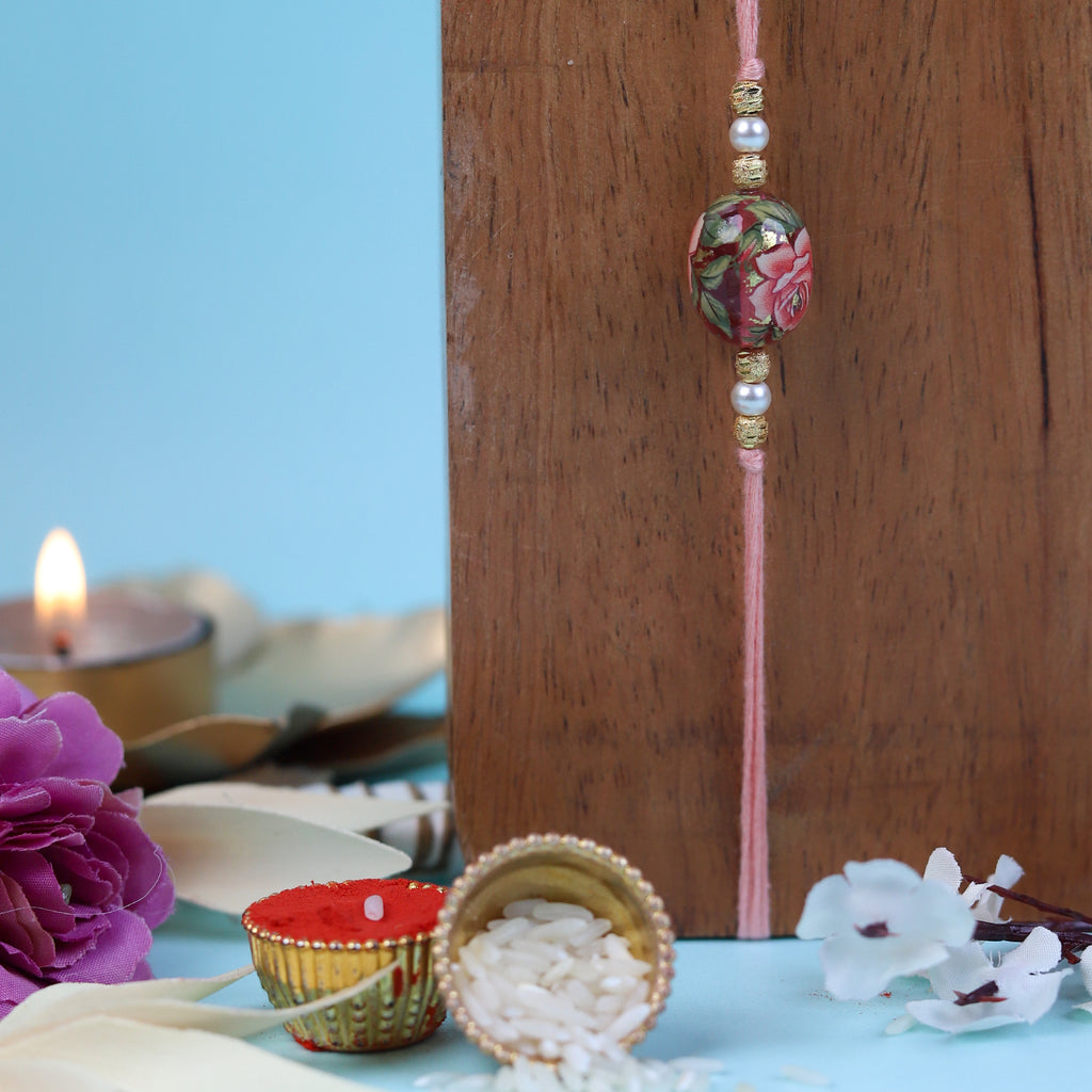 Exquisite Floral Print Bead Rakhi with Roli-Chawal Pouches & Designer Ganesha Greeting Card | Traditional Brother-Sister Raksha Bandhan Gift Set