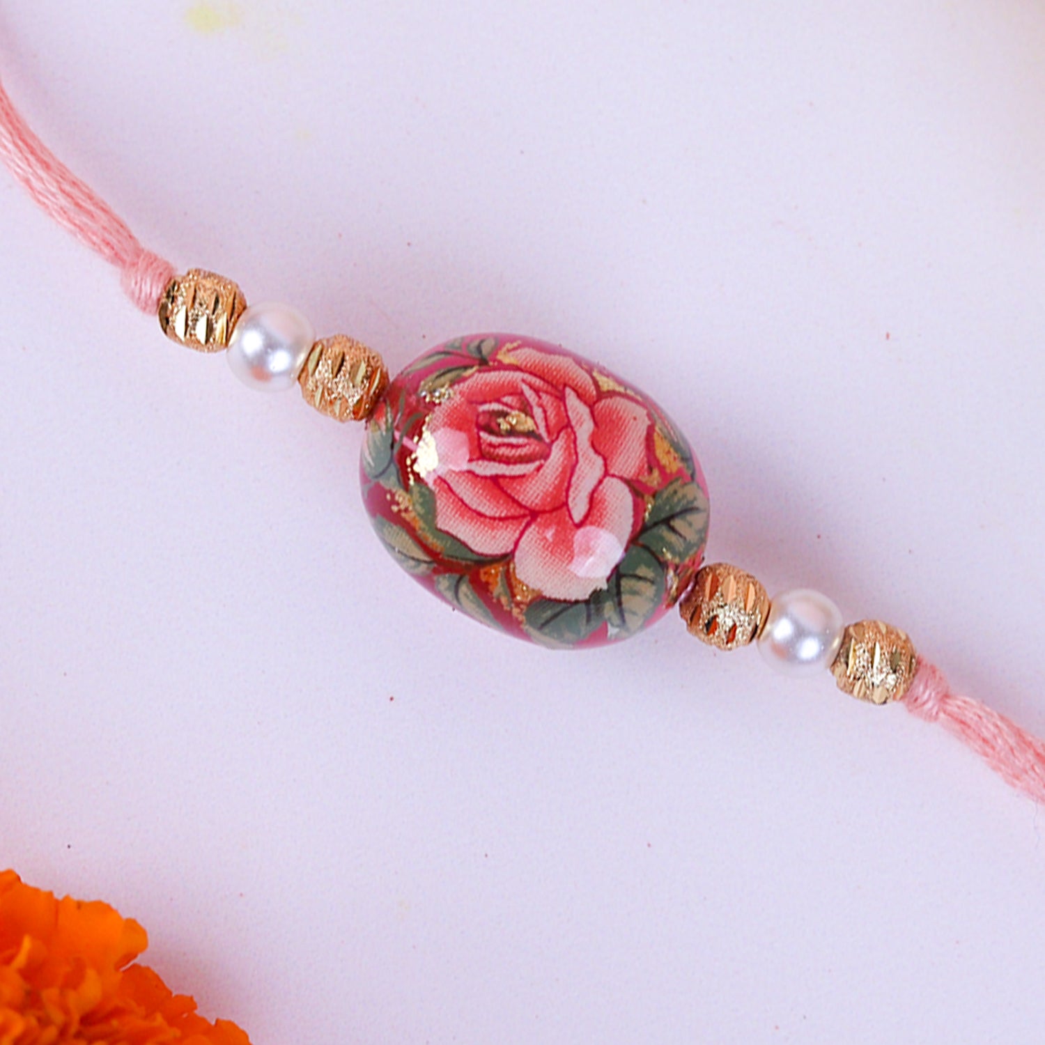 Exquisite Floral Print Bead Rakhi with Roli-Chawal Pouches & Designer Ganesha Greeting Card | Traditional Brother-Sister Raksha Bandhan Gift Set